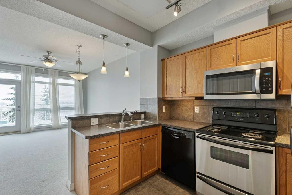 Photo of 133 Rockyledge View NW #14, Calgary, AB T3G 5X2 (MLS # A2302976)