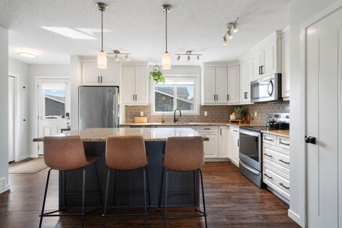 Photo of 5 Fireside Cove, Cochrane, AB T4C 0X3 (MLS # A2338863)