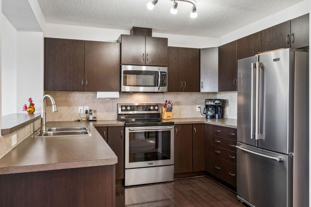 Photo of 150 River Heights Crescent, Cochrane, AB T4C 0J5 (MLS # A2308392)
