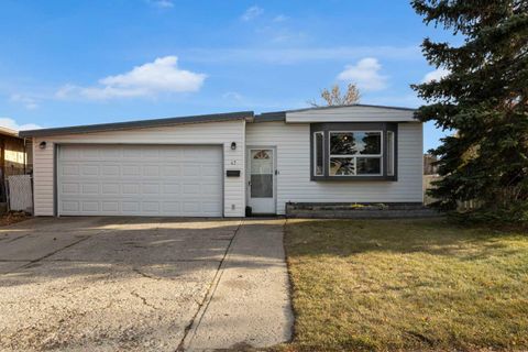 Photo of 47 Huntstrom Drive NE, Calgary, AB T2K 5T4 (MLS # A2273849)