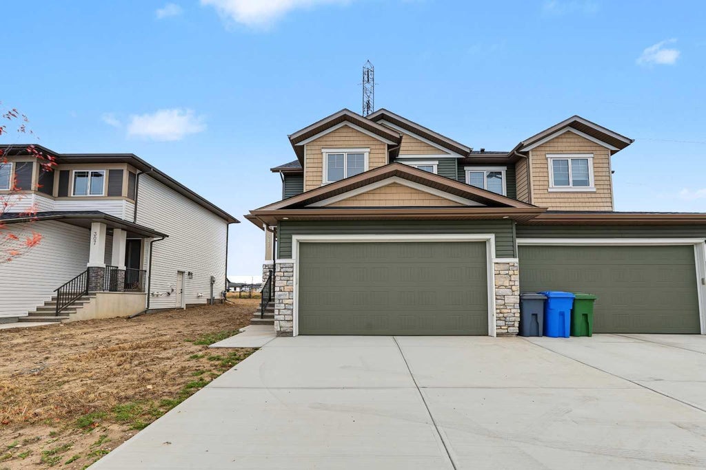 Photo of 311 Dawson Dock Way, Chestermere, AB T1X 2W4 (MLS # A2352652)