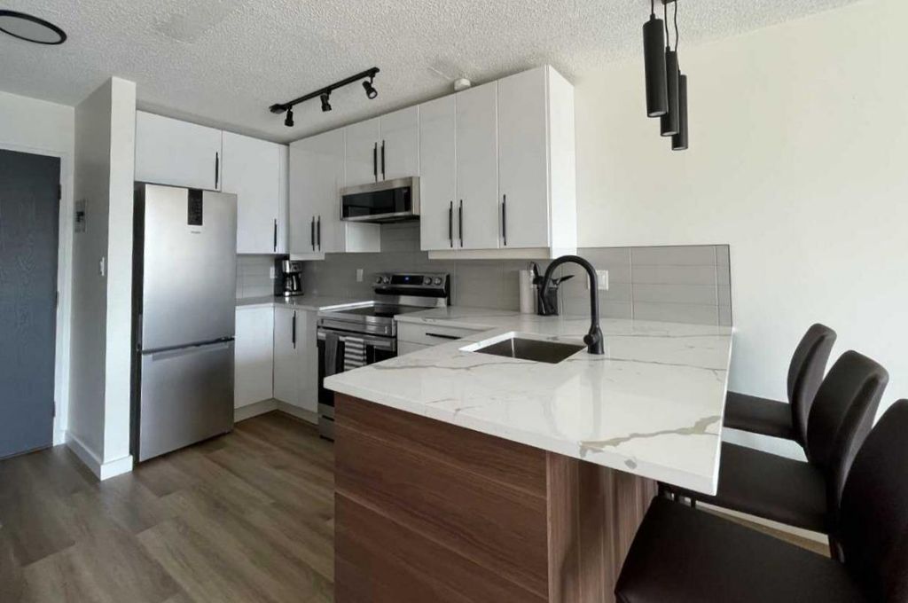 Photo of 340 14 Avenue SW #703, Calgary, AB T2R 0M4 (MLS # A2296698)