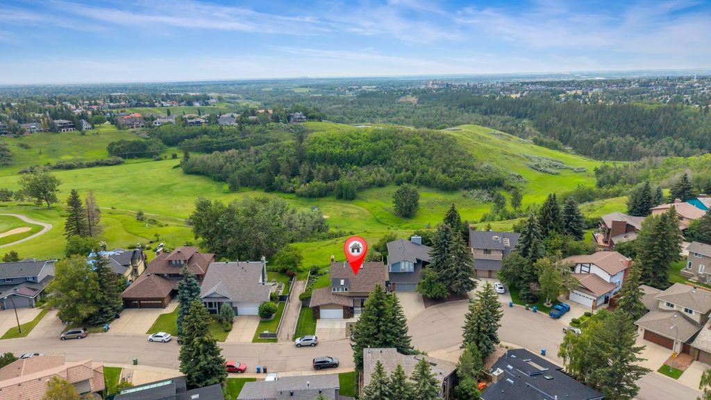 Photo of 24 Woodgrove Crescent SW, Calgary, AB T2W 3Z1 (MLS # A2326744)