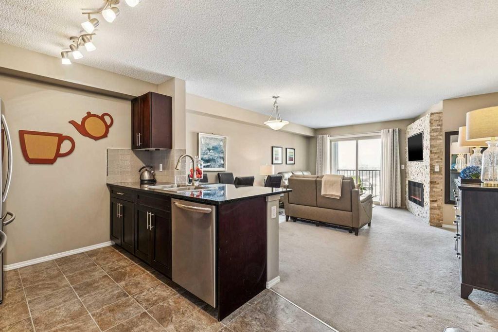Photo of 403 Mackenzie Way SW #6409, Airdrie, AB T4B 3V7 (MLS # A2289895)