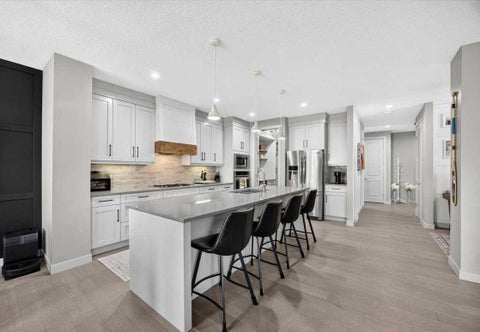 Photo of 136 Riviera Way, Cochrane, AB T4C 0V4 (MLS # A2346344)