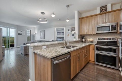 Photo of 15 Sunset Square #2203, Cochrane, AB T4C 0E7 (MLS # A2341928)