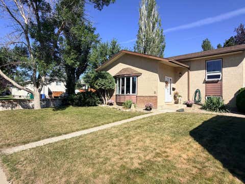 Photo of 11 Lakhota Crescent W, Lethbridge, AB T1K 6J3 (MLS # A2339890)