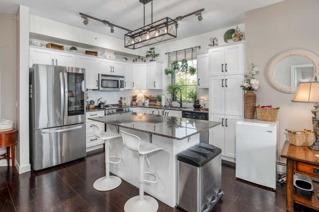 Photo of 205 Sunset Drive #320, Cochrane, AB T4C 0H6 (MLS # A2339002)