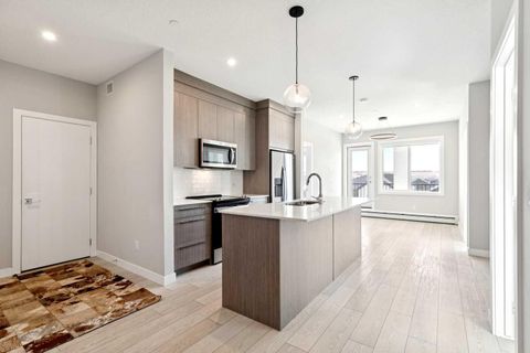 Photo of 111 Wolf Creek Drive SE #1305, Calgary, AB T2X 5X2 (MLS # A2304195)
