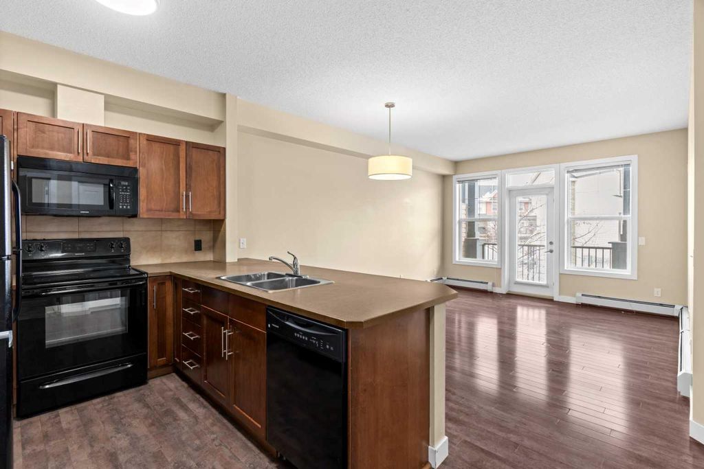 Photo of 10 Panatella Road NW #212, Calgary, AB T3K 0V4 (MLS # A2298777)