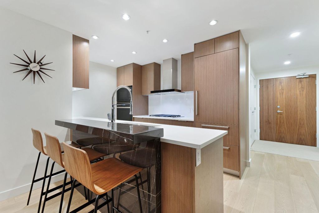 Photo of 128 Waterfront Court SW #104, Calgary, AB T2P 1K9 (MLS # A2264821)