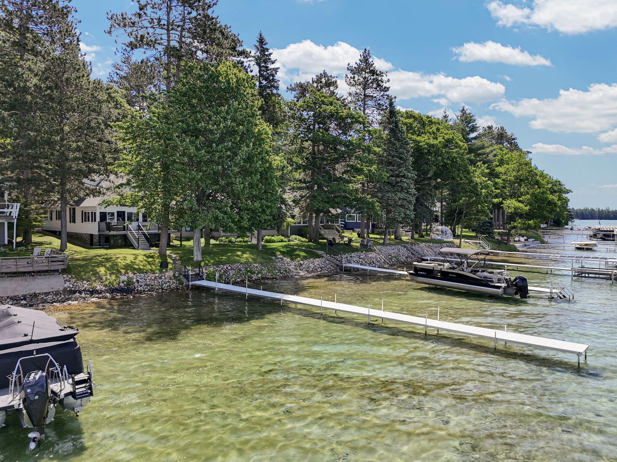 Enjoy breathtaking sunsets from this Higgins Lake waterfront home loca – image 48
