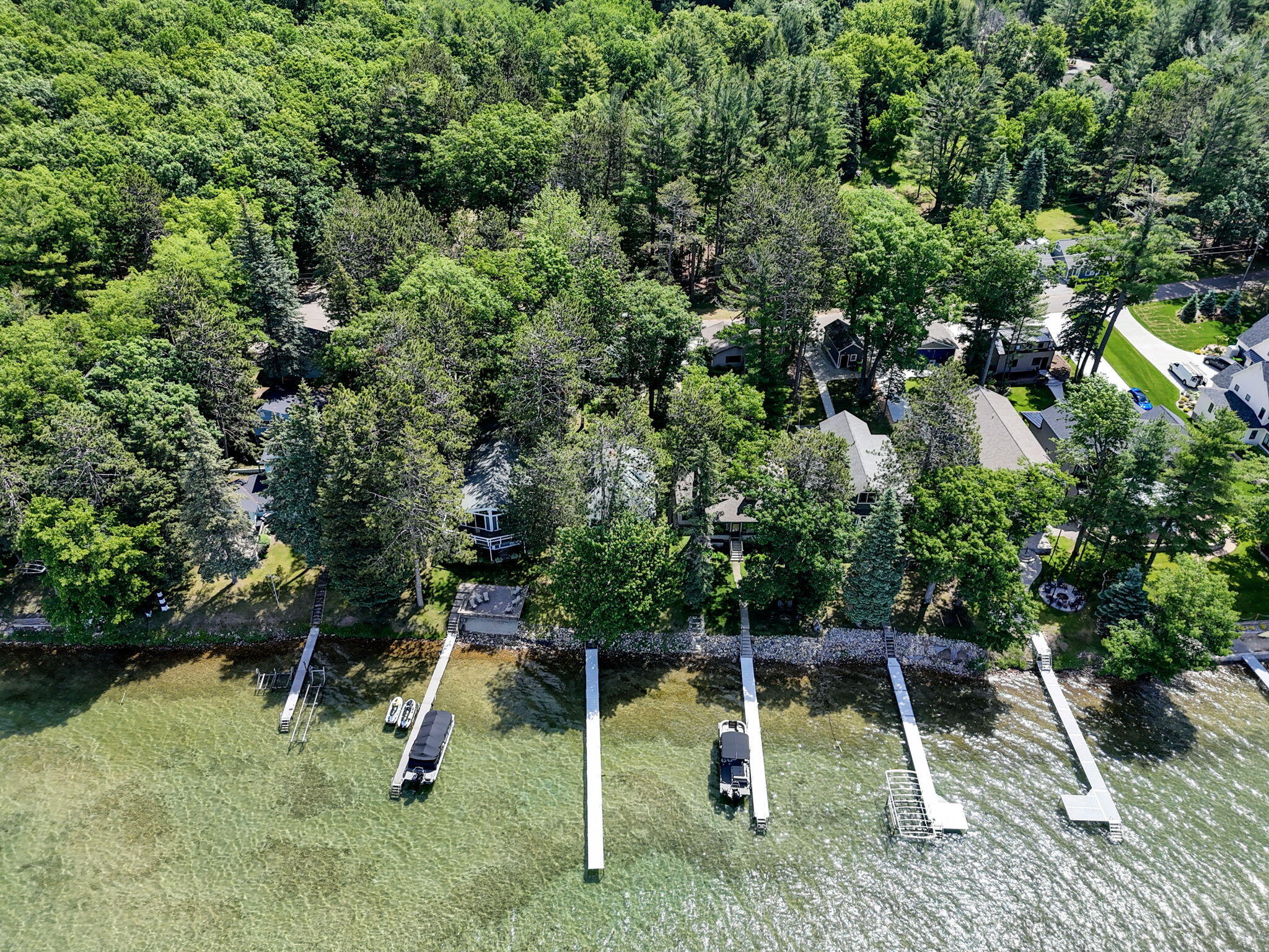 Enjoy breathtaking sunsets from this Higgins Lake waterfront home loca – image 52