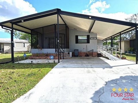 Photo of 14238 Royal Tara Dr #823, Orlando, FL 32826 (MLS # 11693337)