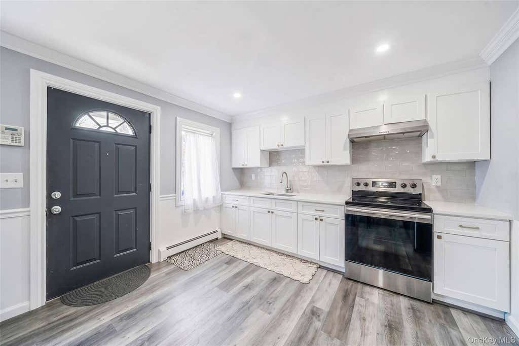 Photo of 5 Sinclair Street, Mastic, NY 11950 (MLS # 11937117)