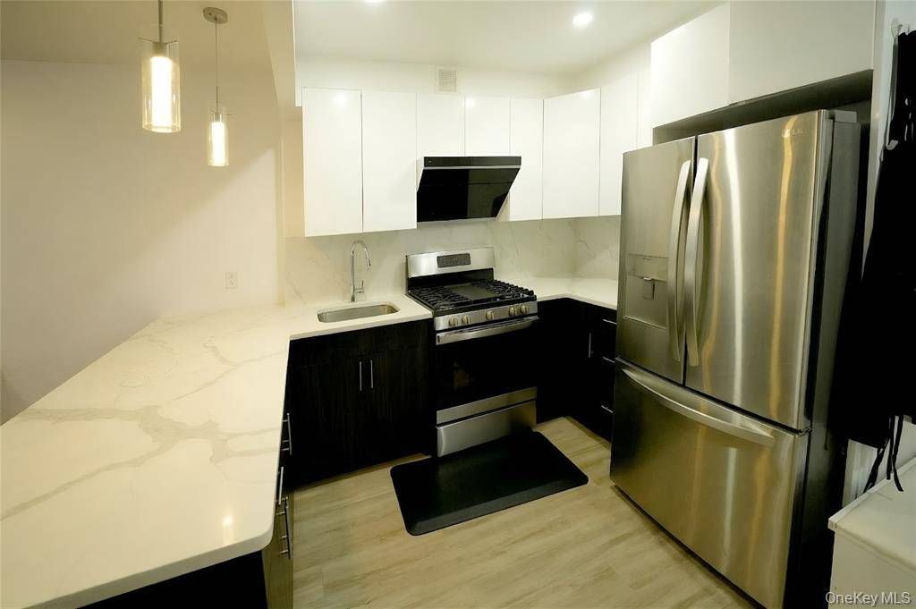 Photo of 7065 Queens Boulevard #8J, Woodside, NY 11377 (MLS # 11775160)