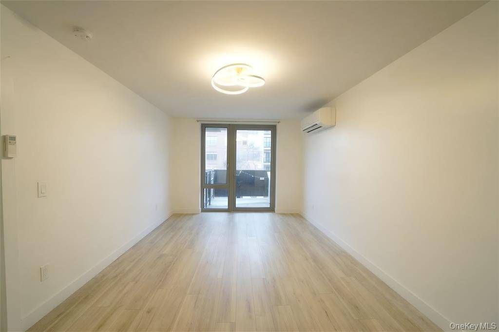 Photo of 7065 Queens Boulevard #8J, Woodside, NY 11377 (MLS # 11775160)