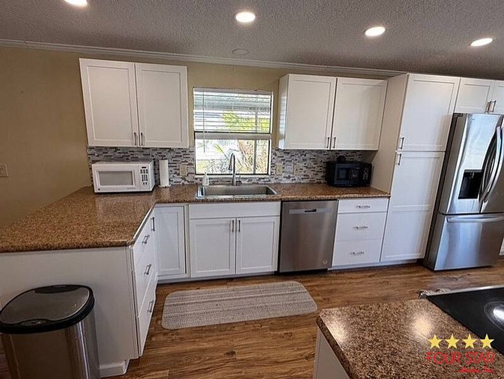 Photo of 28 Falls Way Dr, Ormond Beach, FL 32174 (MLS # 11641535)