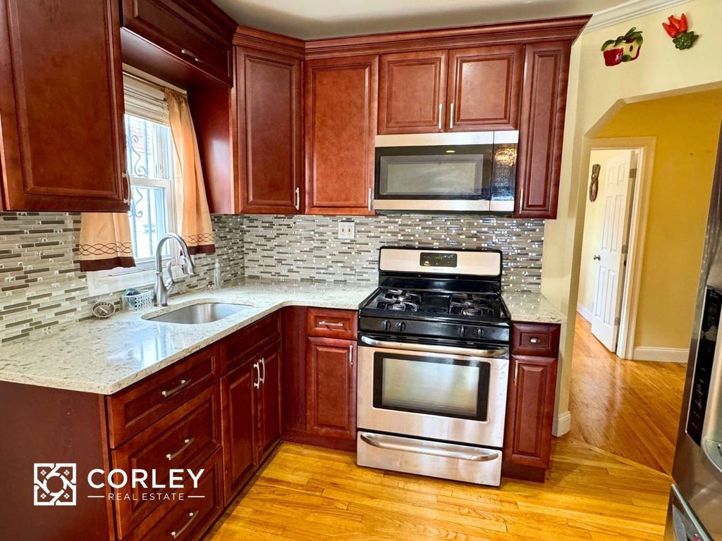 Photo of 12042 231st St, New York, NY 11411 (MLS # 11612922)