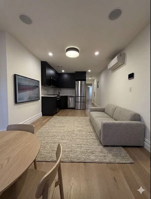 Photo of 409 Bainbridge St #TOWNHOUSE, Brooklyn, NY 11233 (MLS # 11741146)