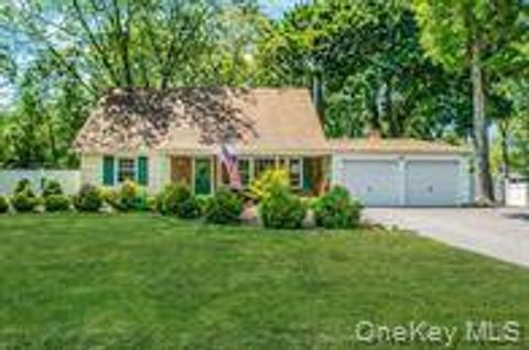 Photo of 20 Wintergreen Dr, Coram, NY 11727 (MLS # 11779336)
