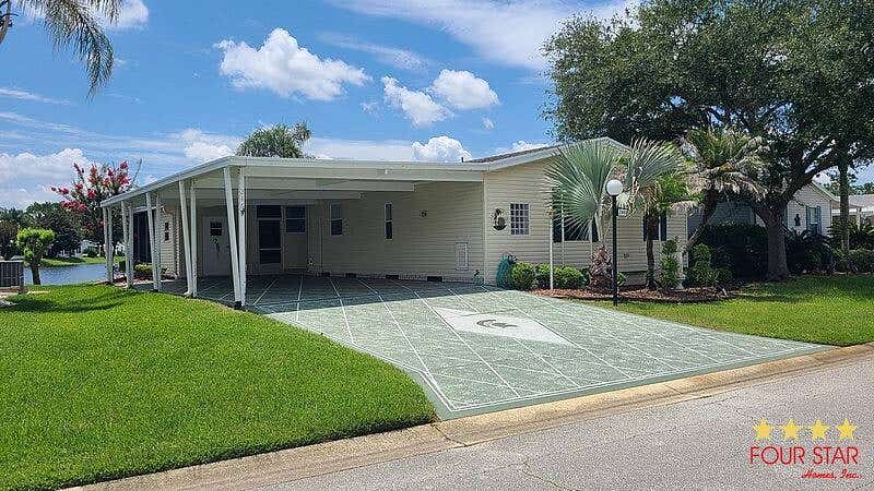 Photo of 246 Blue Heron Lake Cir, Ormond Beach, FL 32174 (MLS # 11855435)