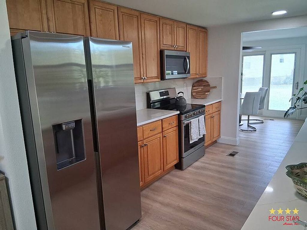 Photo of 14971 Firestone Circle, Orlando, FL 32826 (MLS # 11622820)