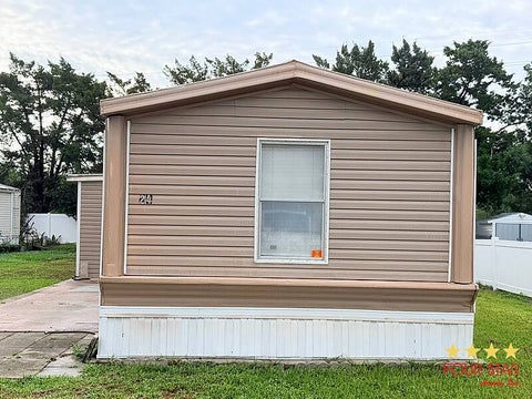 Photo of 24 Palm Castle Drive, Port Orange, FL 32127 (MLS # 11852301)
