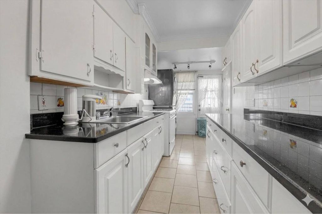 Photo of 9213 91st Ave, Woodhaven, NY 11421 (MLS # 11675750)