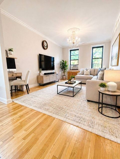 Photo of 8401 Main St #311, Briarwood, NY 11435 (MLS # 11737403)