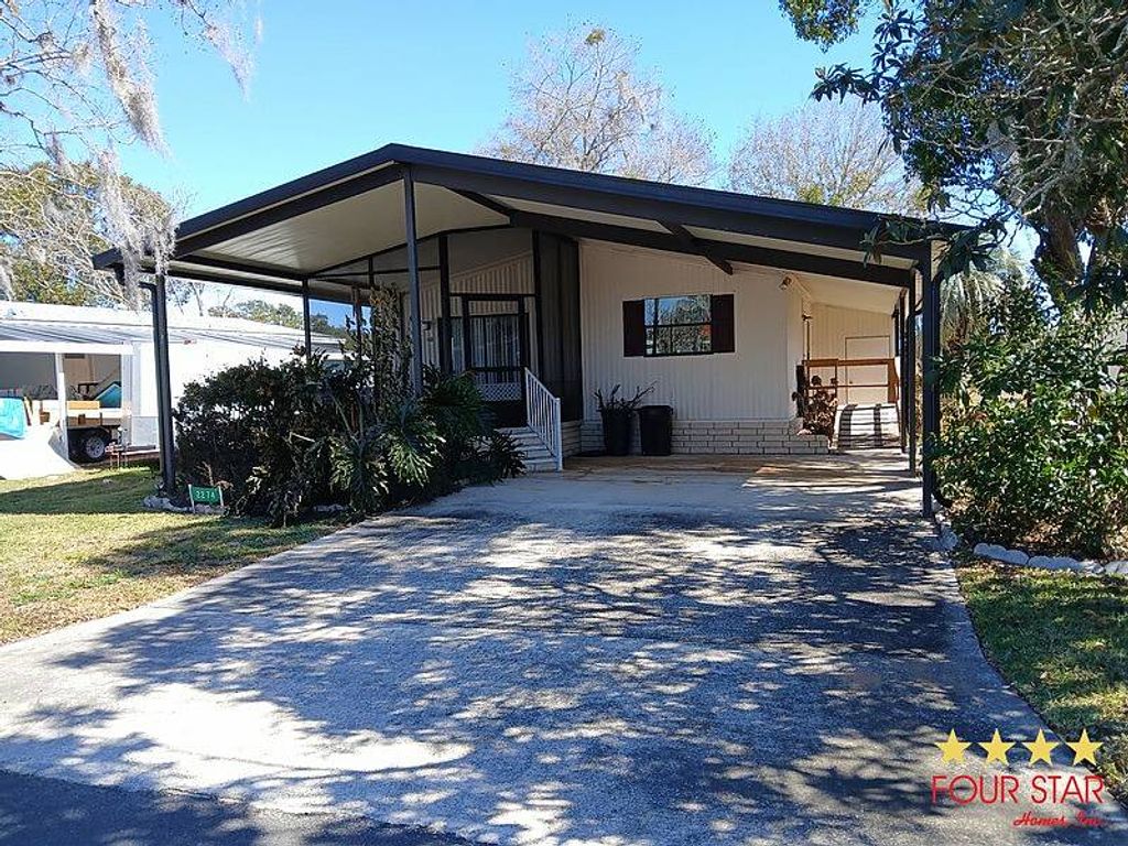 Photo of 2274 Pebble Beach Blvd, Orlando, FL 32826 (MLS # 11650844)