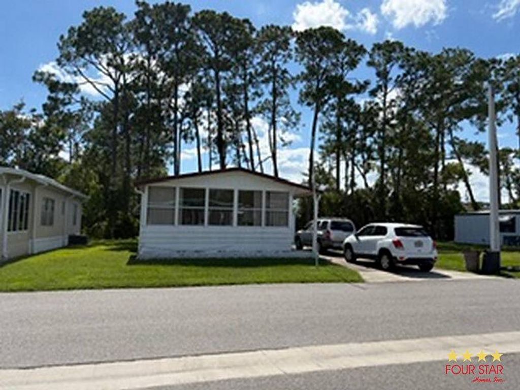 Photo of 68 Regency Dr, Port Orange, FL 32129 (MLS # 11852291)