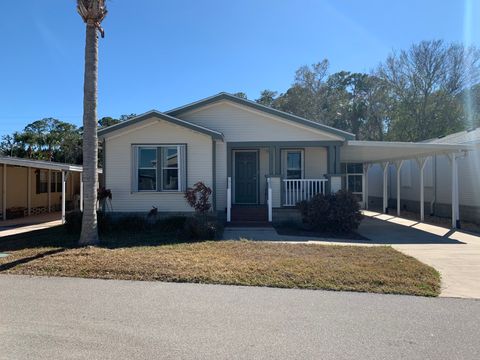 Photo of 58 Pelican Dr, New Smyrna Beach, FL 32168 (MLS # 11653911)