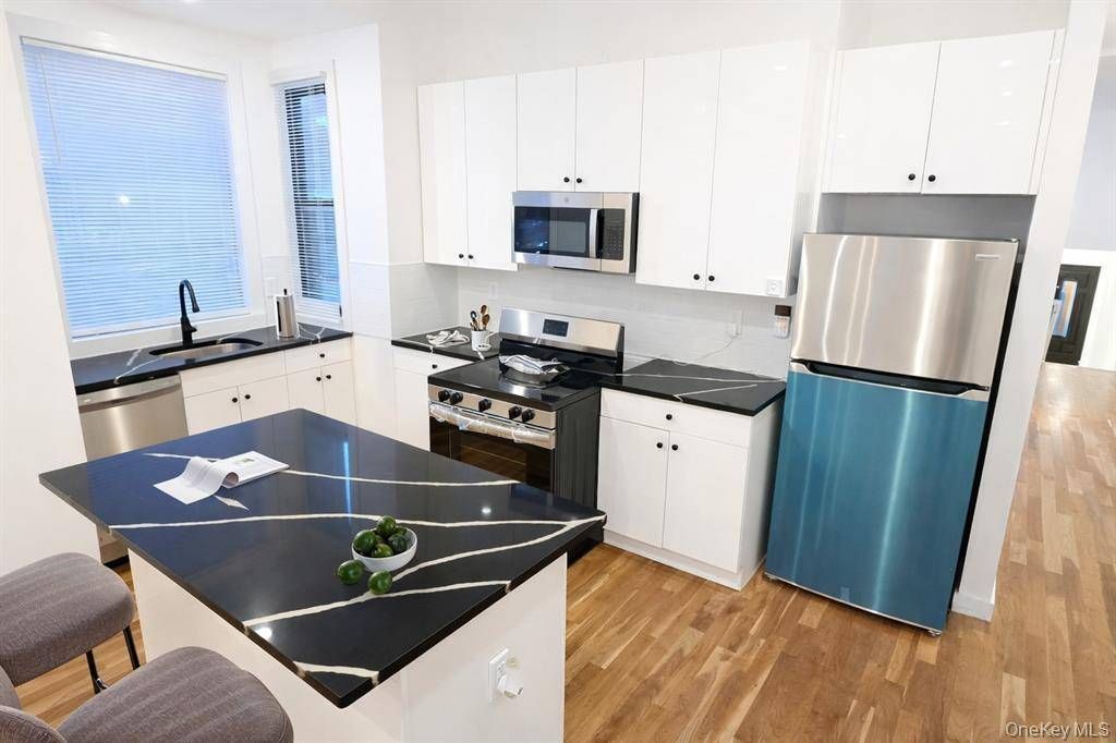 Photo of 32 Radde Place, Brooklyn, NY 11233 (MLS # 11635191)