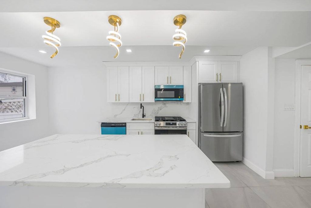 Photo of 10945 173rd St, Jamaica, NY 11433 (MLS # 11612864)