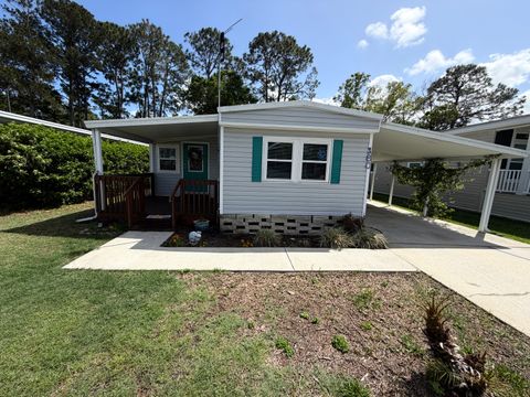 Photo of 180 Fox Fire Cir, New Smyrna Beach, FL 32168 (MLS # 11691464)