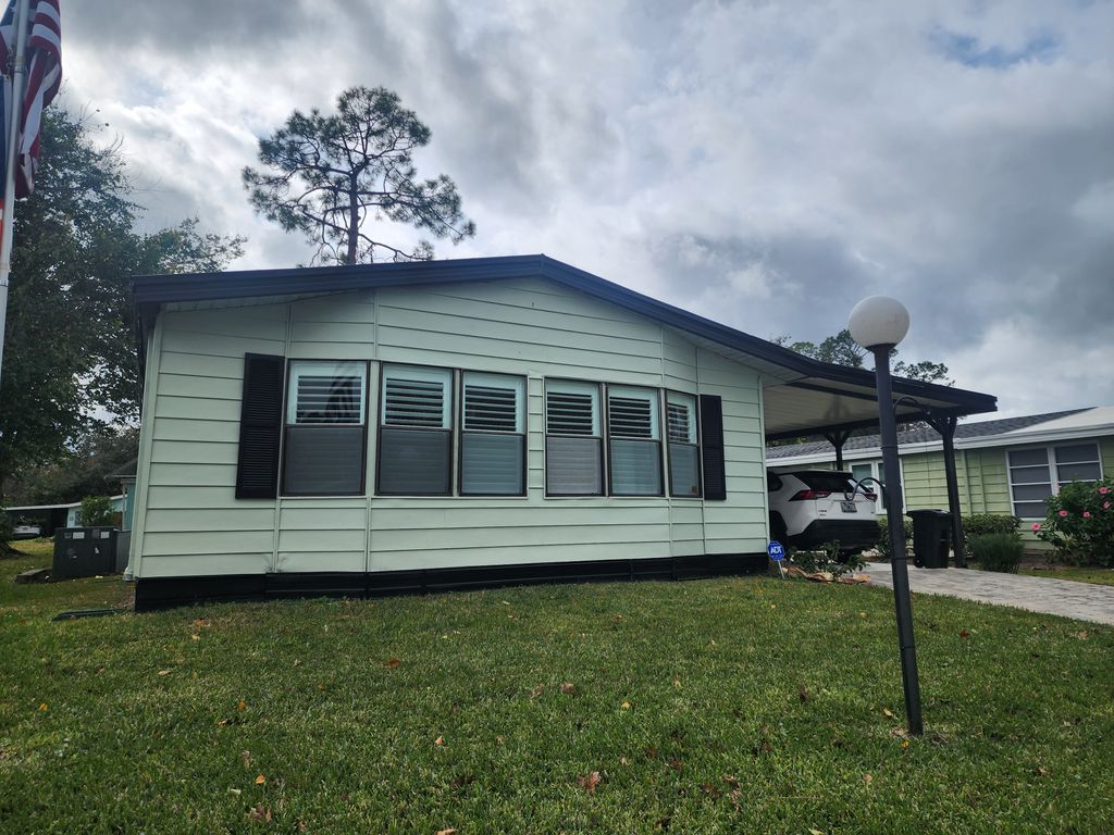 Photo of 6 Sunset Falls Dr, Ormond Beach, FL 32174 (MLS # 11618325)