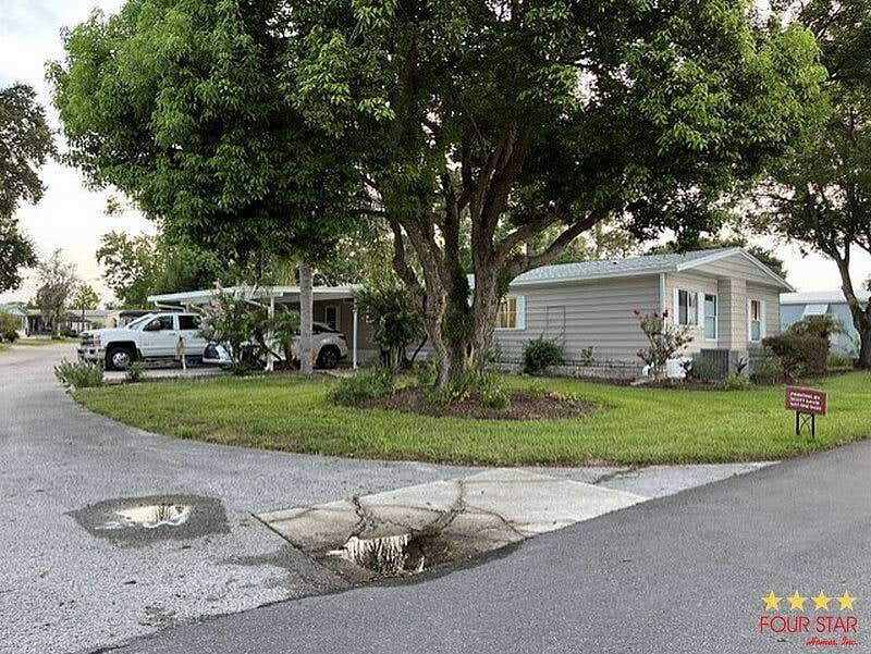 Photo of 2156 Pebble Beach Blvd, Orlando, FL 32826 (MLS # 11920699)