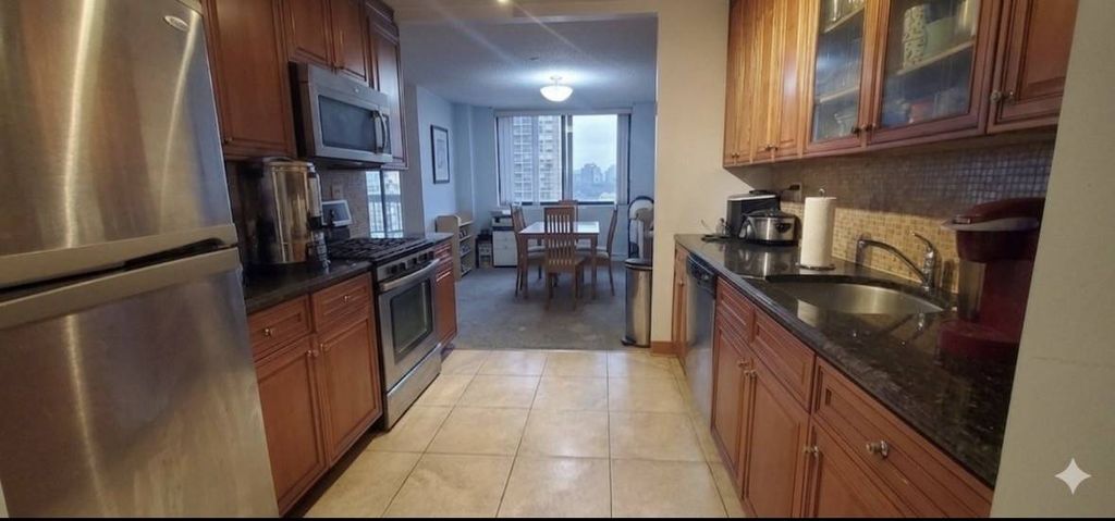 Photo of 2 Bay Club Dr #8W, Bayside, NY 11360 (MLS # 11682808)