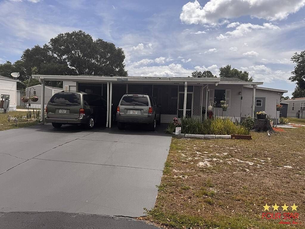 Photo of 1904 Galaxy Dr, Lake Wales, FL 33859 (MLS # 11776184)