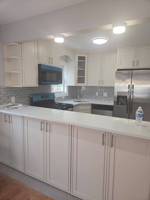 Photo of 16712 110th Ave, Jamaica, NY 11433 (MLS # 11607819)