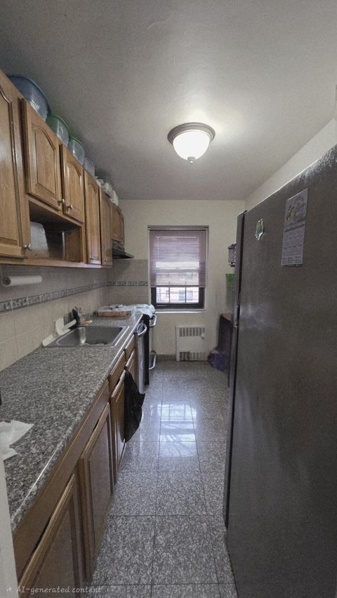 Photo of 11860 Metropolitan Ave #3E, Kew Gardens, NY 11415 (MLS # 11653941)