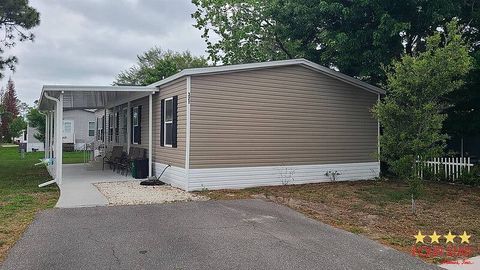 Photo of 321 Banyan Ln, Port Orange, FL 32127 (MLS # 11687973)