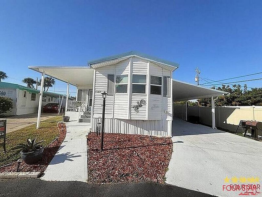 Photo of 918 Reed Canal Rd #342, South Daytona, FL 32119 (MLS # 11641646)