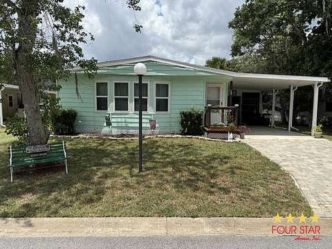 Photo of 30 Ribbon Falls Drive, Ormond Beach, FL 32174 (MLS # 11866622)