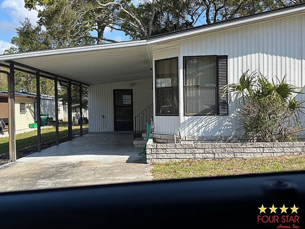 Photo of 2373 Sandlewood Ln, Orange City, FL 32763 (MLS # 11683394)