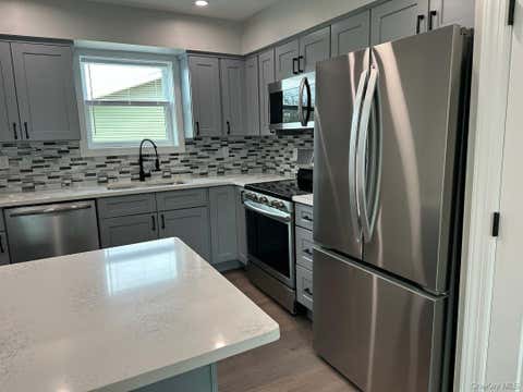 Photo of 99 N. Railroad Avenue, Babylon, NY 11702 (MLS # 11684552)