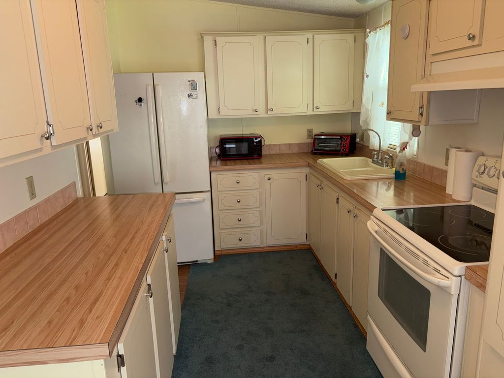 Photo of 4861 Spruce Creek Rd, Port Orange, FL 32127 (MLS # 11741399)