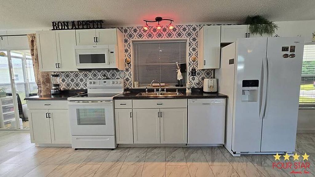 Photo of 7831 Walkers Cay Ave #2224, Orlando, FL 32822 (MLS # 11740667)