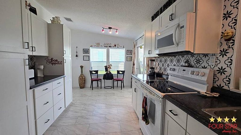 Photo of 7831 Walkers Cay Ave #2224, Orlando, FL 32822 (MLS # 11740667)